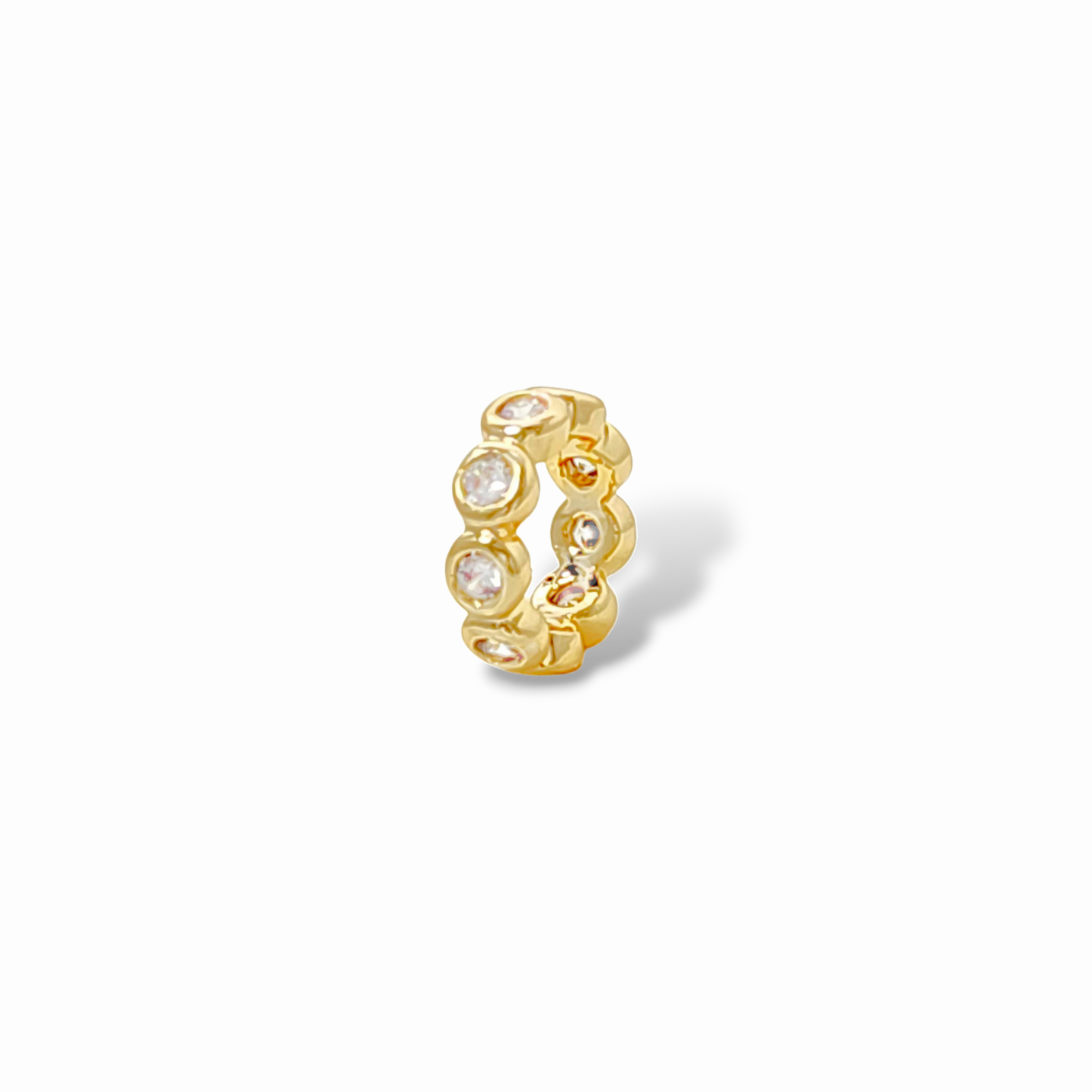 Pearl white bezel-set stone huggie hoop earring in 18k gold plated brass