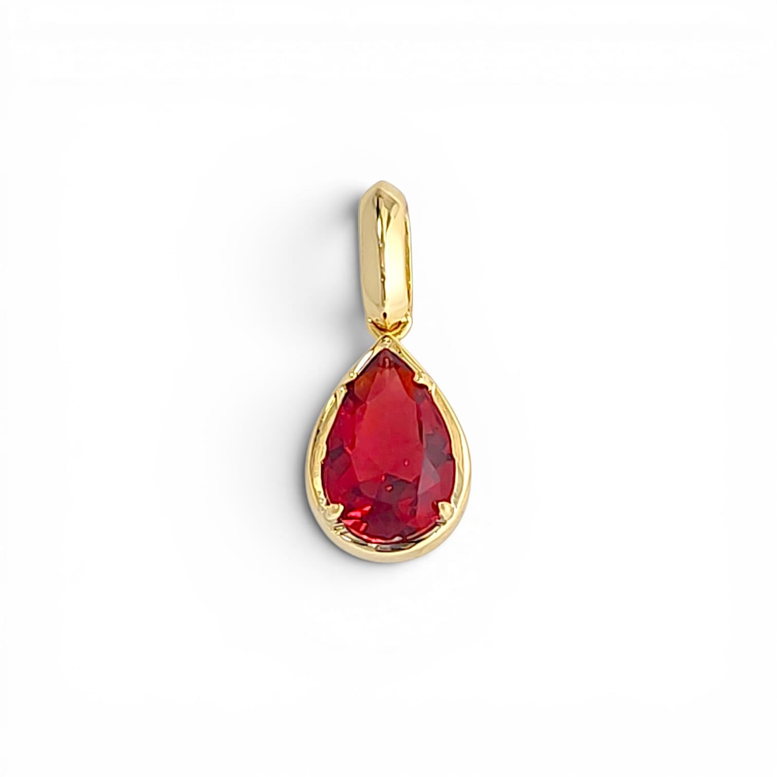 Red pear-cut crystal pendant in 18k gold plated bezel with pave bail