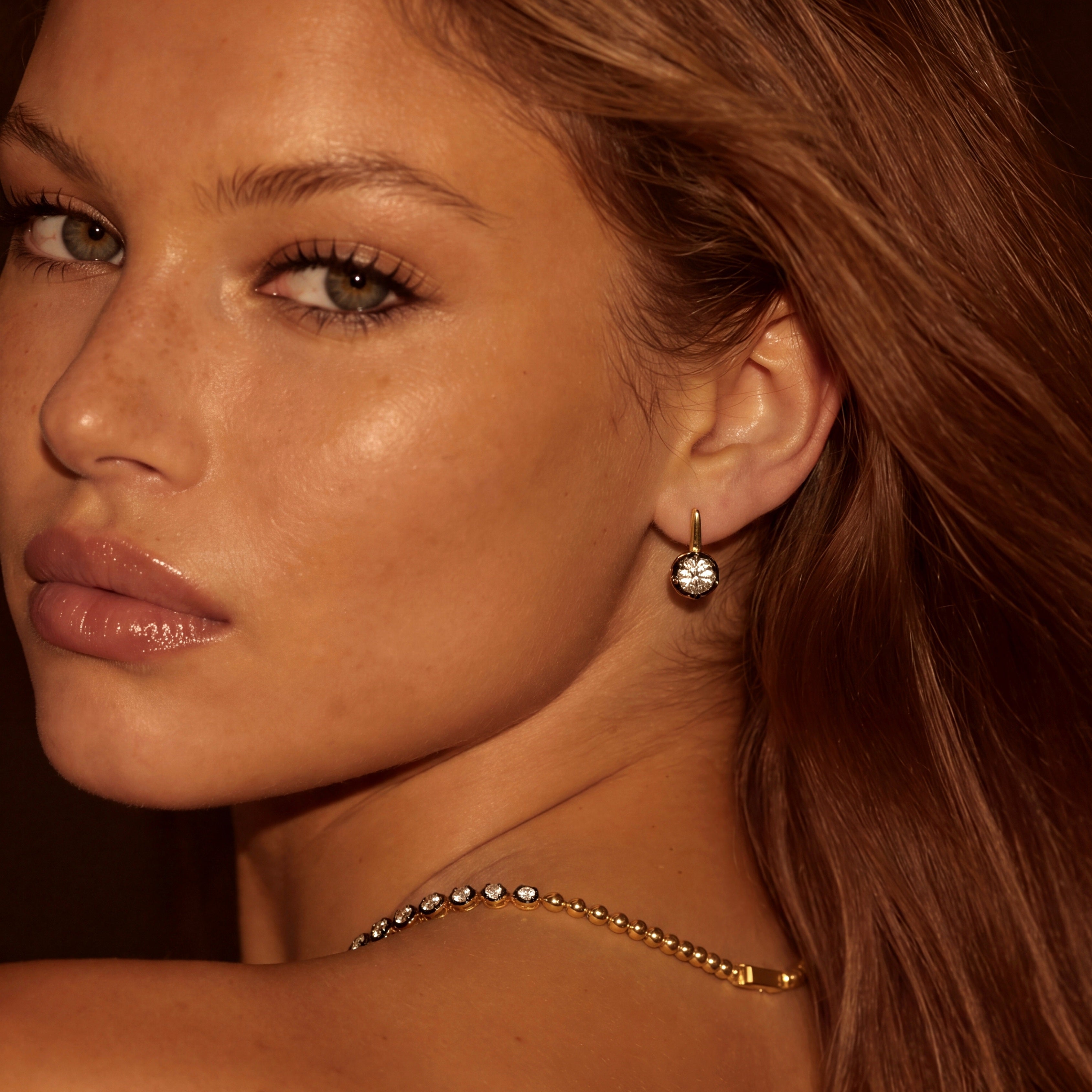 black bezel prone gold earring stud